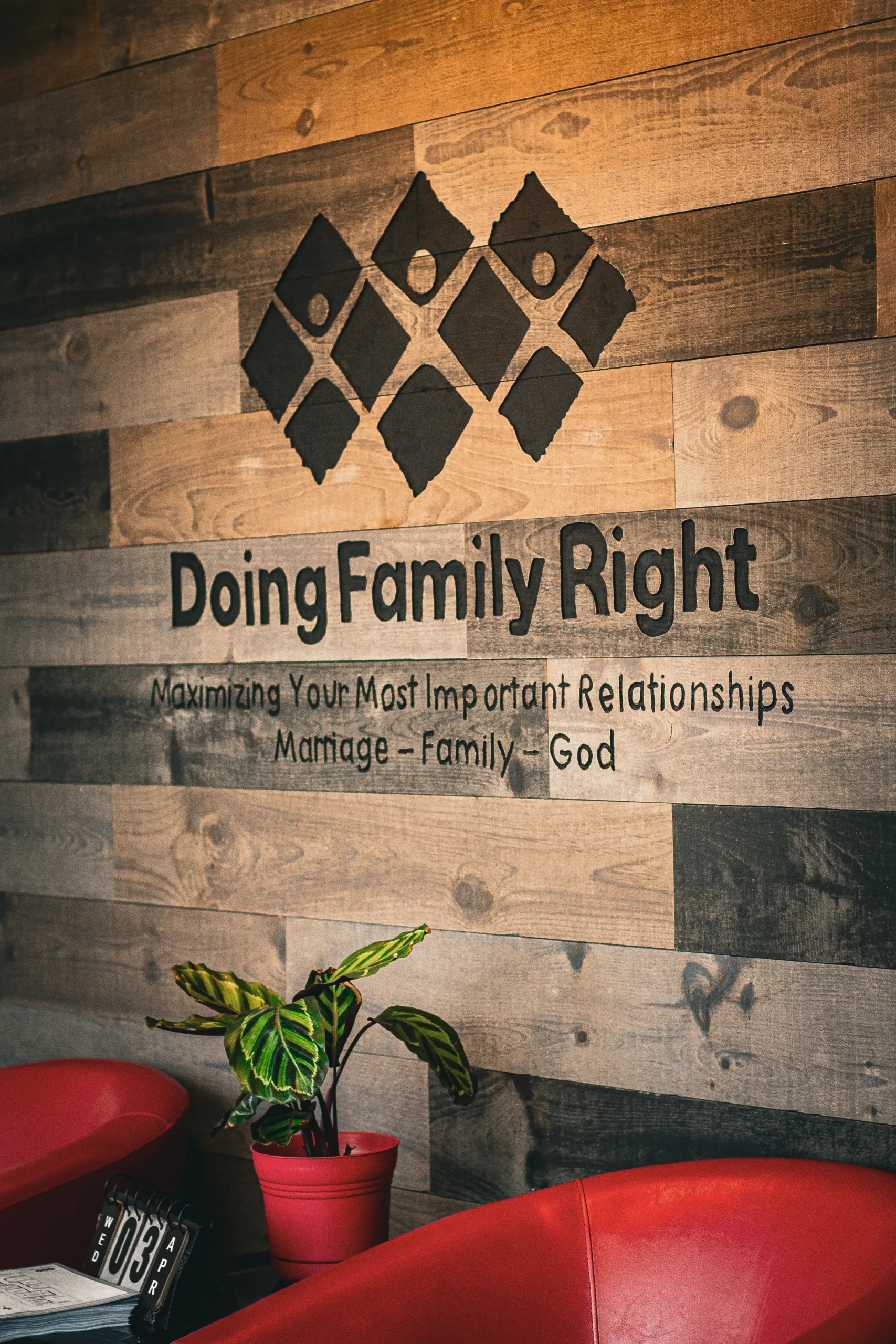 "filename": "Header-Photo-Resized-scaled-1.webp", "page_title": "Doing Family Right", "description": "A wooden wall display f
