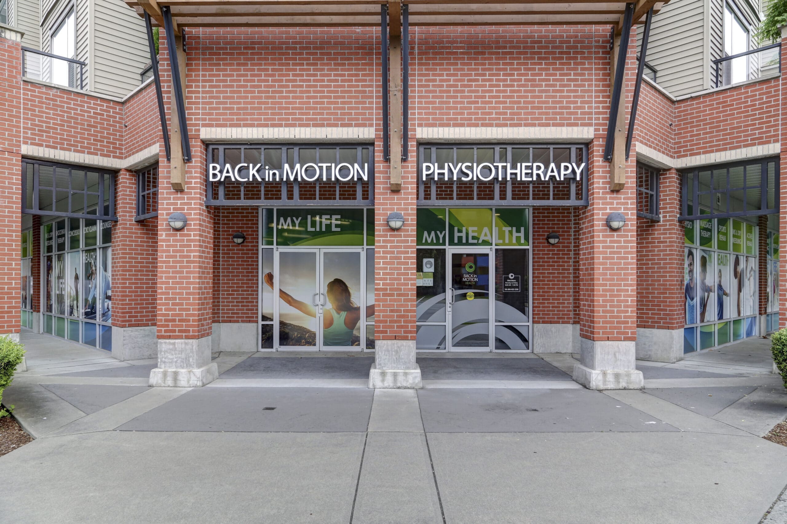 Back in Motion Physiotherapy storefront in Abbotsford with red brick facade and glass entrance doors displaying My Life Health signage