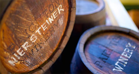 Wooden barrels with text etched on them at The Old Spaghetti Factory in Abbotsford