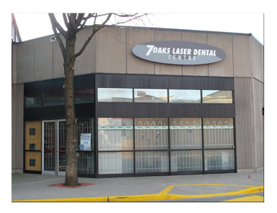 Exterior view of 7 Oaks Laser Dental clinic in Abbotsford with storefront signage and large front windows
