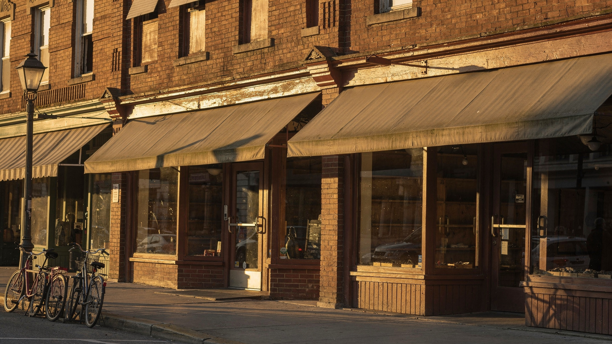 Row of early twentieth century brick heritage storefronts in Historic Downtown Abbotsford, BC